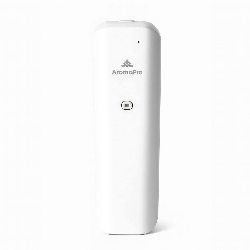 Modern AromaPro diffuser placed on a sleek white countertop with soft lighting and minimalist decor in the background, showcasing its elegant black design and premium feel — ideal for home fragrance and aromatherapy.